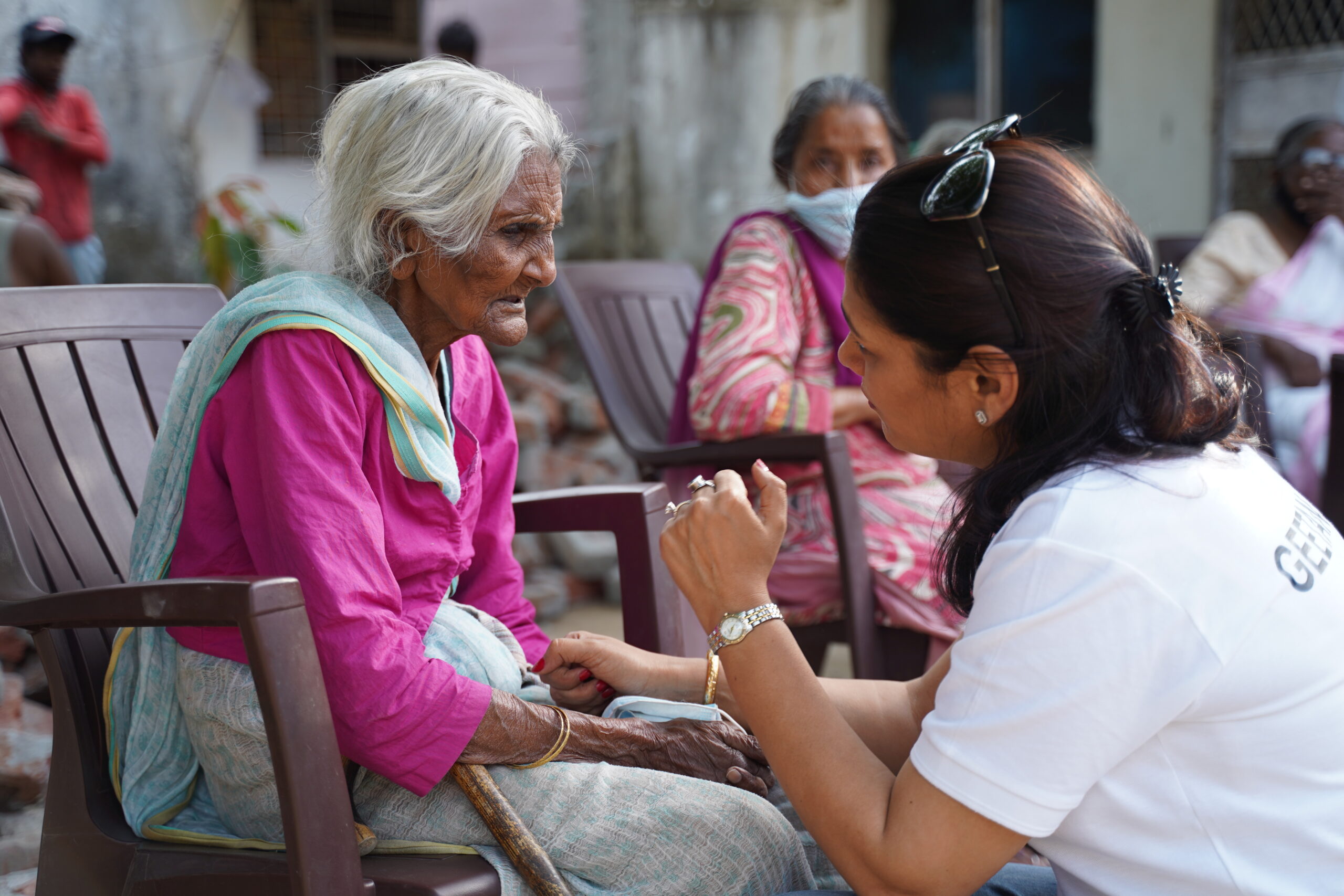 Indian elderly person with young student volunteer - SevaSetu community service